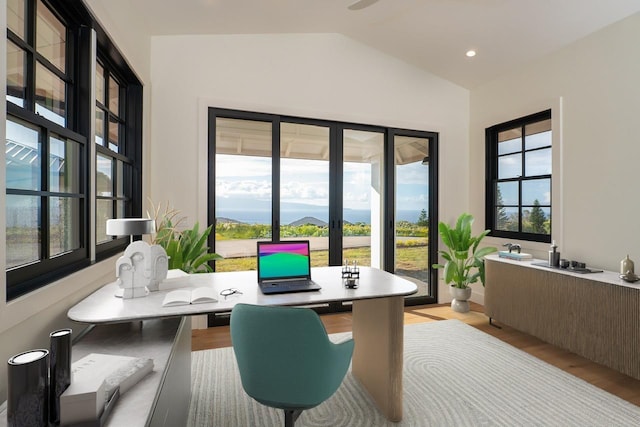 home office with lofted ceiling, light wood finished floors, and recessed lighting