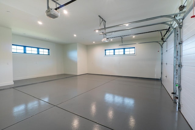 garage featuring a garage door opener and recessed lighting