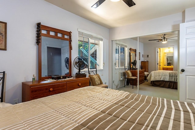 bedroom featuring ceiling fan, a closet, and carpet floors