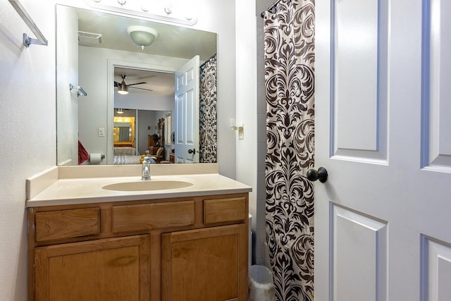 bathroom with ceiling fan and vanity