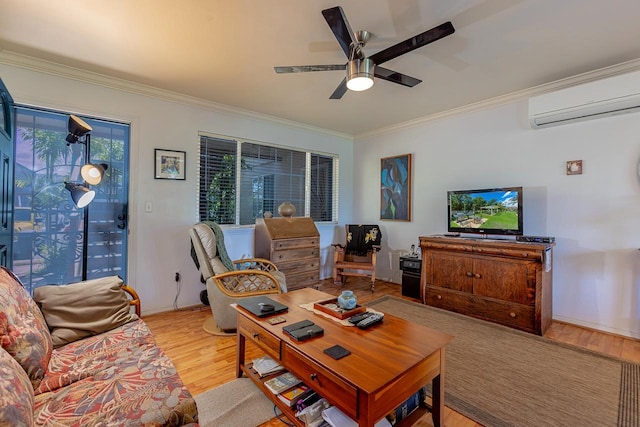 living room featuring ceiling fan, a wall unit AC, crown molding, and light hardwood / wood-style flooring