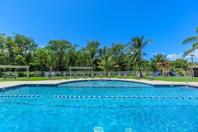 view of pool with a playground