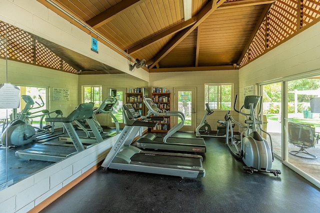 exercise room featuring vaulted ceiling and wood ceiling