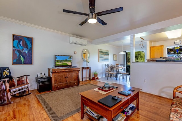 living room featuring crown molding, ceiling fan, an AC wall unit, and light hardwood / wood-style floors