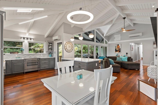 dining area featuring high vaulted ceiling, ceiling fan, dark hardwood / wood-style flooring, and a wall unit AC