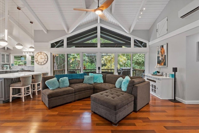 living room featuring dark wood-type flooring, high vaulted ceiling, ceiling fan, beamed ceiling, and a wall unit AC