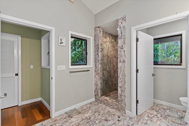 bathroom with a shower and toilet