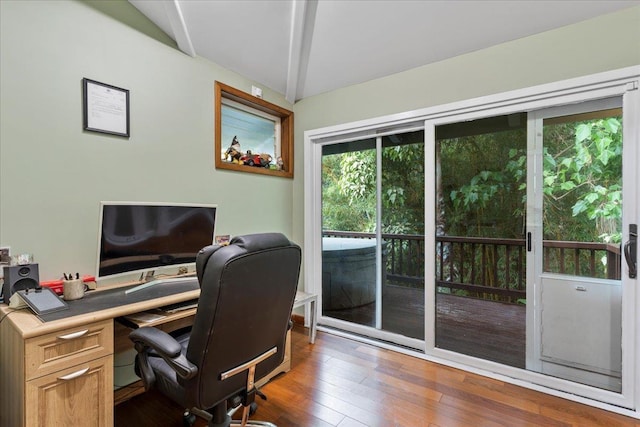 office with dark wood-type flooring and vaulted ceiling