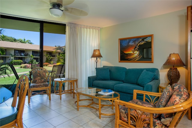 living room featuring ceiling fan and light tile patterned floors