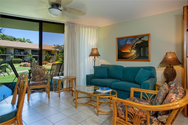 49 W Lipoa St Unit 107, Kihei, HI 96753 - living area with light tile patterned flooring and a ceiling fan