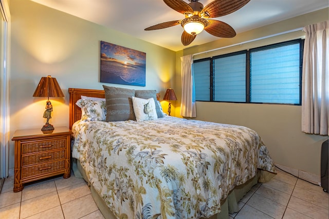 bedroom with light tile patterned floors and ceiling fan