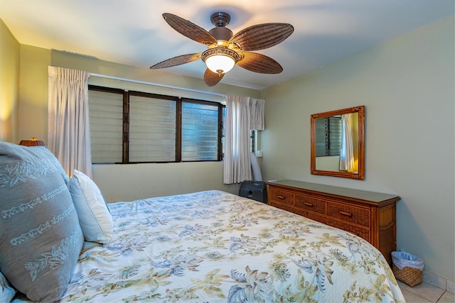 49 W Lipoa St Unit 107, Kihei, HI 96753 - bedroom with a ceiling fan and tile patterned flooring