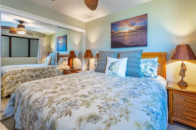 bedroom featuring a closet, tile patterned floors, and ceiling fan