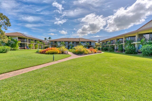 49 W Lipoa St Unit 107, Kihei, HI 96753 - surrounding community with a yard and a residential view