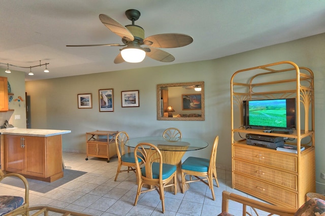 49 W Lipoa St Unit 107, Kihei, HI 96753 - dining room with light tile patterned flooring and ceiling fan
