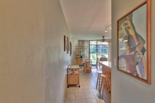 49 W Lipoa St Unit 107, Kihei, HI 96753 - corridor with light tile patterned floors and rail lighting