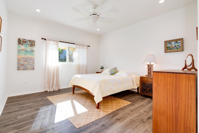 bedroom with hardwood / wood-style flooring and ceiling fan