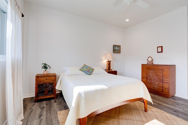 bedroom featuring wood-type flooring and ceiling fan