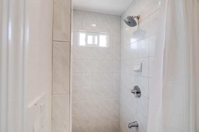 bathroom featuring curtained shower