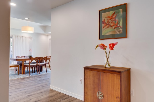 hall with light hardwood / wood-style floors