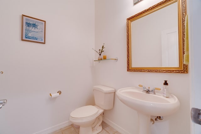 bathroom featuring tile patterned flooring and toilet