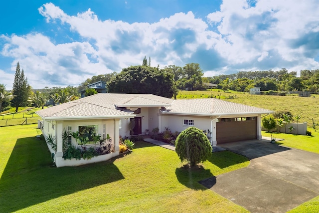 single story home featuring a garage and a front yard