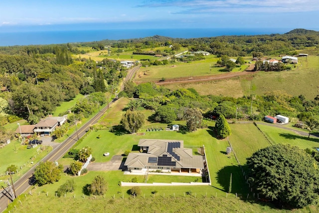 birds eye view of property with a rural view