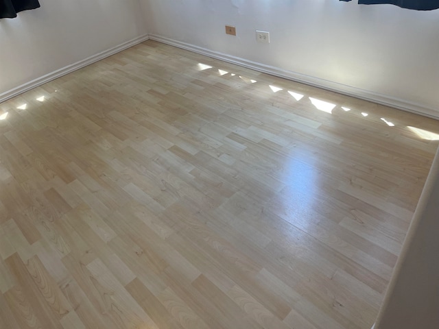 spare room featuring light hardwood / wood-style floors