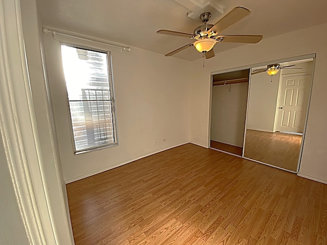 unfurnished bedroom with a closet, ceiling fan, and light hardwood / wood-style flooring