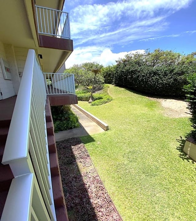 view of yard featuring a balcony