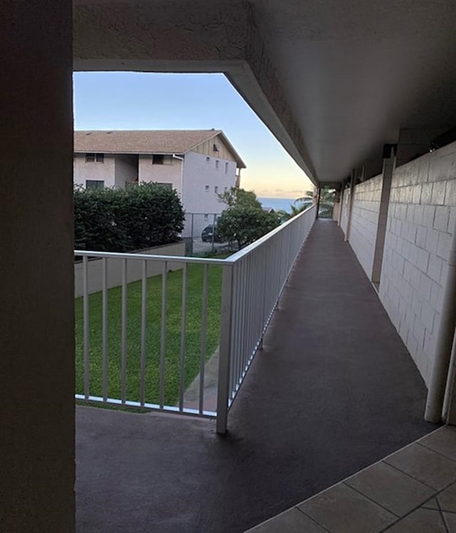 view of balcony at dusk