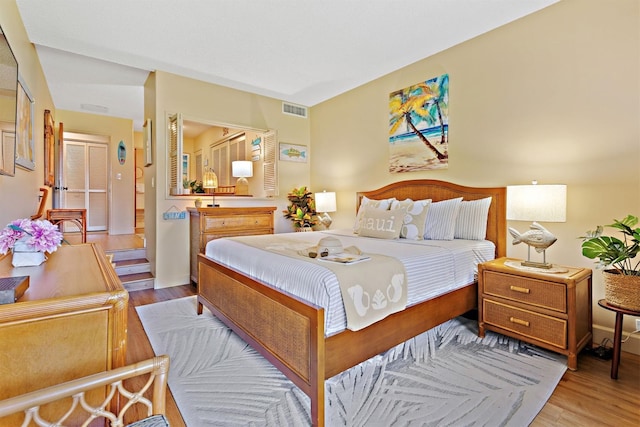 2560 Kekaa Dr Unit F 102, Lahaina, HI 96761 - bedroom with wood finished floors