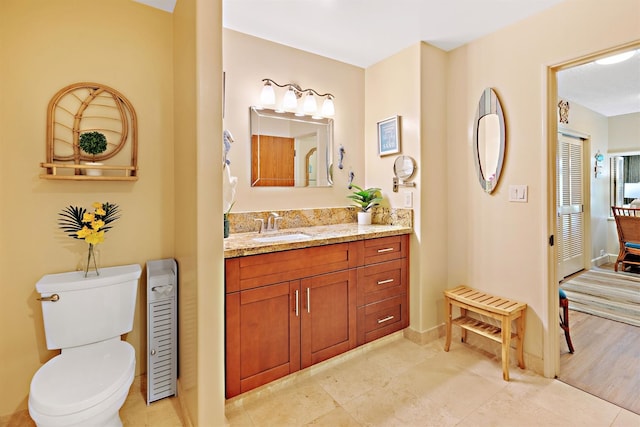 2560 Kekaa Dr Unit F 102, Lahaina, HI 96761 - bathroom with vanity, toilet, and tile patterned flooring