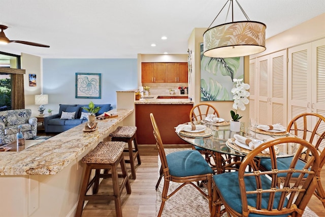 2560 Kekaa Dr Unit F 102, Lahaina, HI 96761 - dining room with light wood-style flooring, a ceiling fan, and recessed lighting