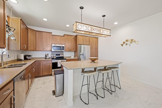 kitchen featuring a sink, brown cabinets, marble finish floor, and appliances with stainless steel finishes