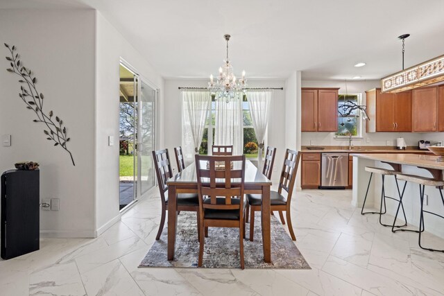 dining room featuring a notable chandelier, baseboards, marble finish floor, and recessed lighting
