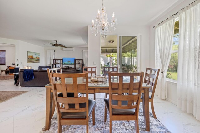 dining room featuring a wall mounted air conditioner, ceiling fan with notable chandelier, and marble finish floor