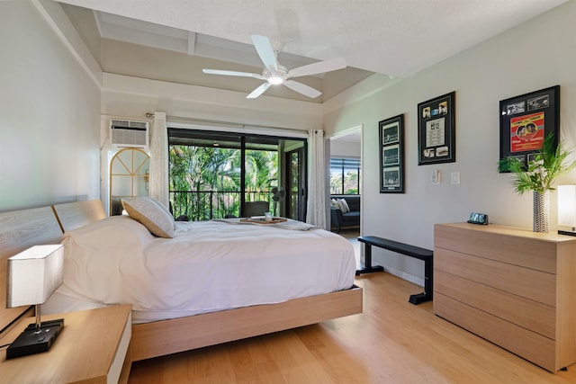 3788 Lower Honoapiilani Rd Unit E212, Lahaina, HI 96761 - bedroom featuring light wood finished floors, access to outside, an AC wall unit, ceiling fan, and baseboards