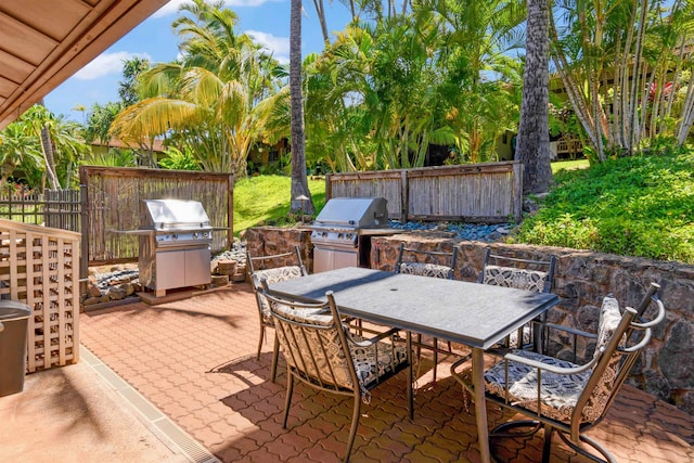 3788 Lower Honoapiilani Rd Unit E212, Lahaina, HI 96761 - view of patio / terrace featuring outdoor dining space and grilling area