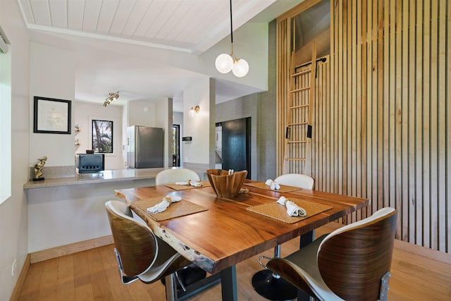 3788 Lower Honoapiilani Rd Unit E212, Lahaina, HI 96761 - dining area with light wood-style flooring and wooden ceiling with exposed beams