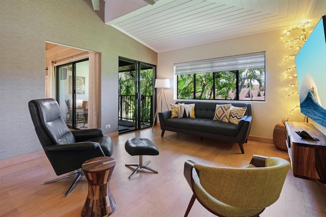 3788 Lower Honoapiilani Rd Unit E212, Lahaina, HI 96761 - living room with wood ceiling, wood finished floors, baseboards, and ornamental molding