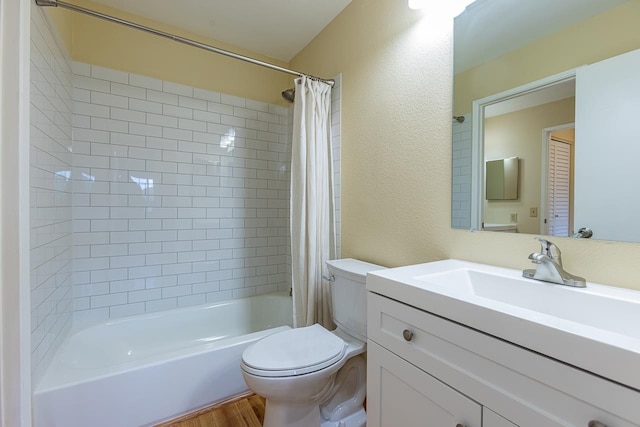 full bathroom featuring toilet, hardwood / wood-style floors, vanity, and shower / bath combination with curtain