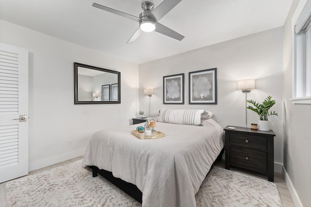 bedroom featuring a ceiling fan and baseboards