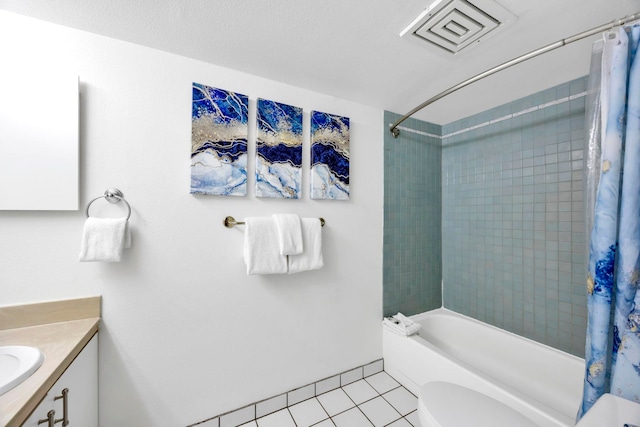 full bathroom with toilet, vanity, tile patterned flooring, and shower / tub combo with curtain