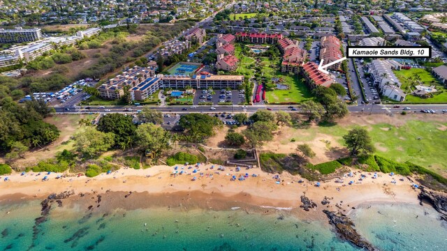 bird's eye view with a beach view and a water view