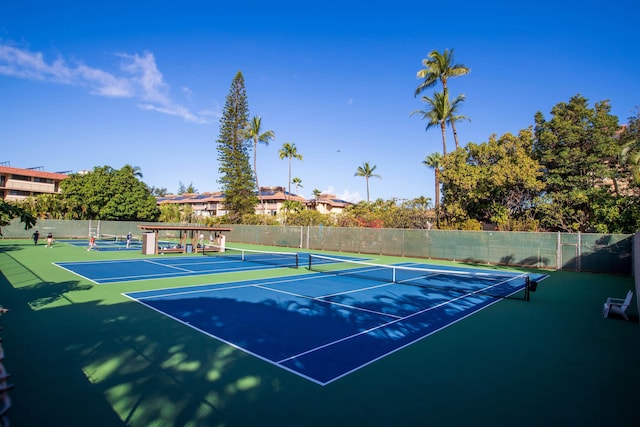 view of sport court with basketball hoop