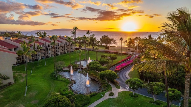 aerial view at dusk with a water view