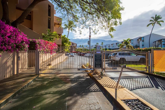 view of gate with a mountain view