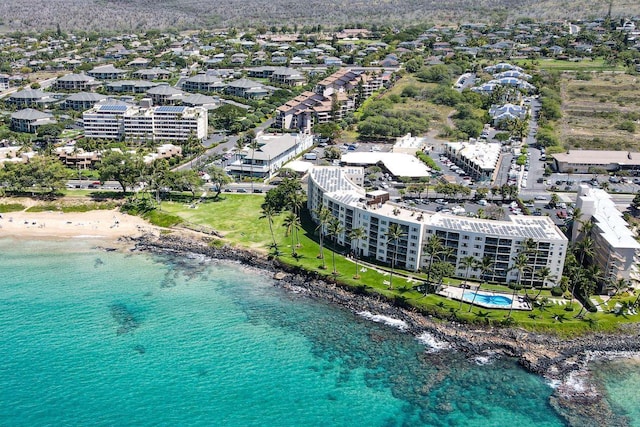 bird's eye view featuring a water view and a beach view