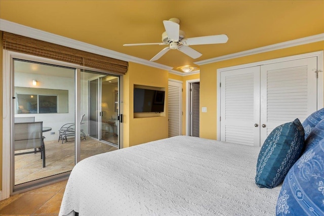 bedroom with ceiling fan, ornamental molding, and two closets